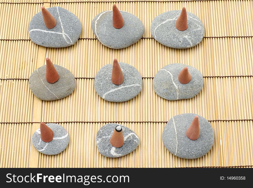 Top view of row incense cones and stone. Top view of row incense cones and stone