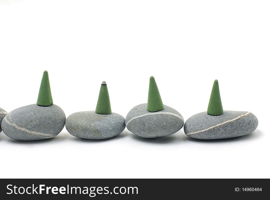 Incense cones and stone  on white. Incense cones and stone  on white