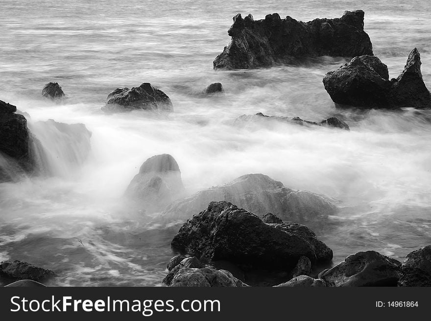 B&W of foggy ocean cliffs on the coast of lanzarote island