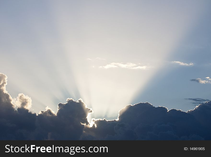 Photo of white fluffy cumulus clouds with beautiful sunset lights