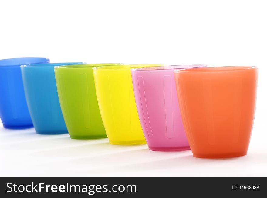 Row of Various coloured cups. Row of Various coloured cups