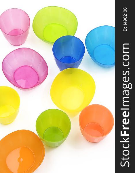Colorful plastic cups and dish. Colorful plastic cups and dish