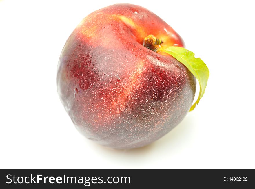 Ripe Peach with Leaf on White. Ripe Peach with Leaf on White