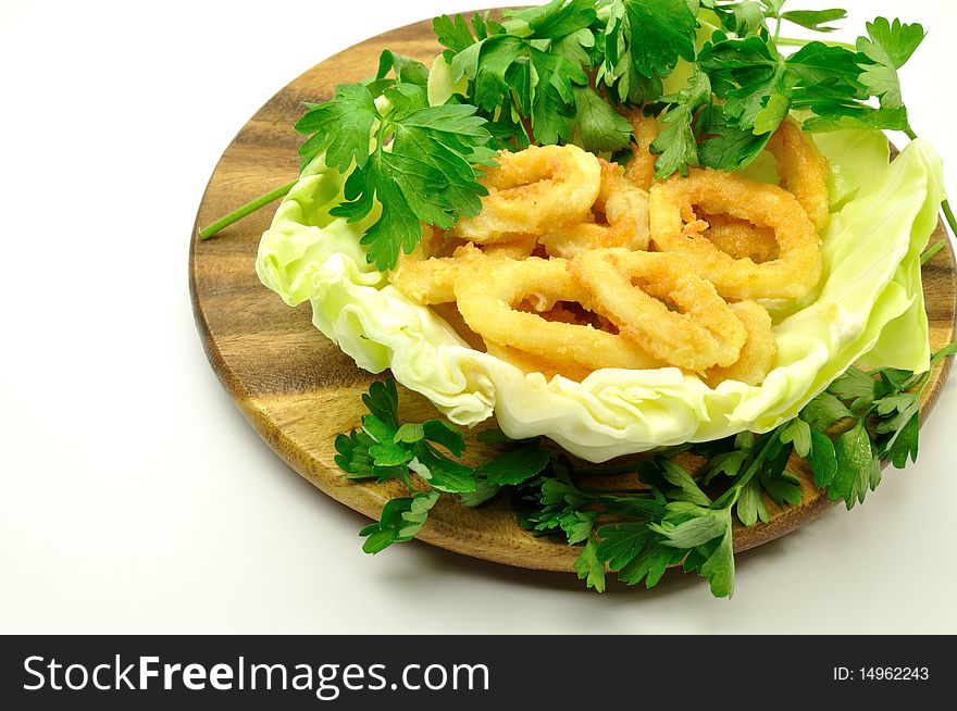Fried squid rings with green. Fried squid rings with green
