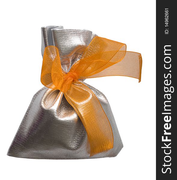 In the silver bag with orange bow. In the silver bag with orange bow