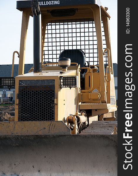 Bulldozer idle on construction site