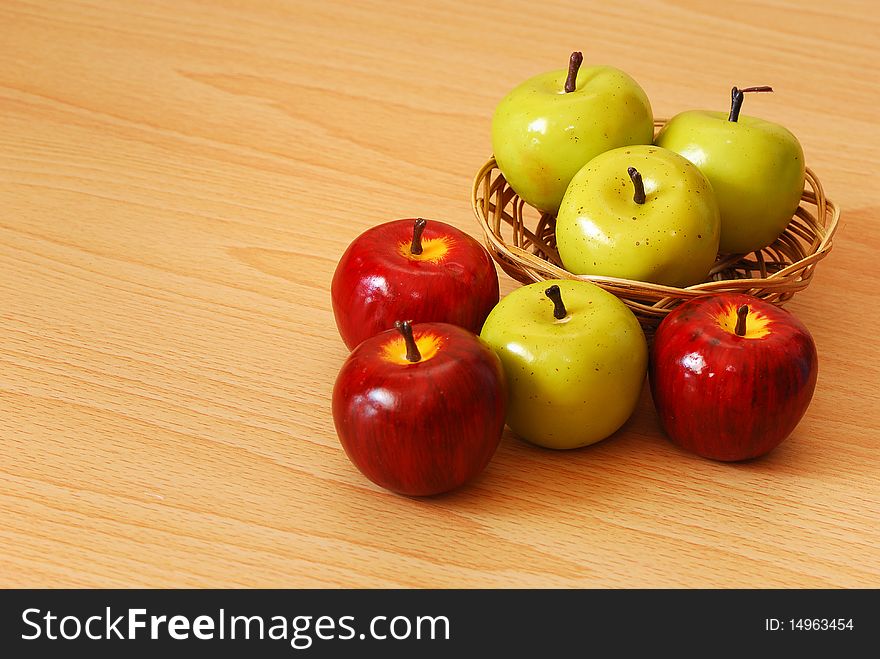 A colorful apple basket with green and red apples