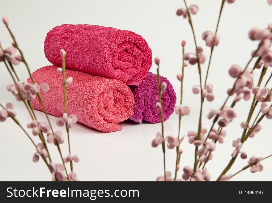 Towels are behind pink flower