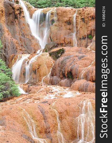 Waterfall with red soils called gold-fall