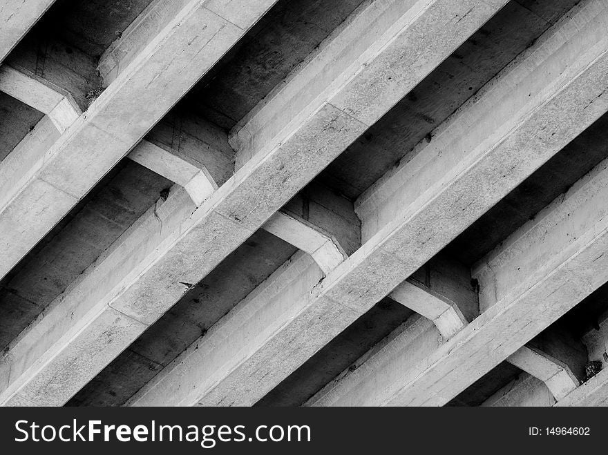 Black and white image of the underside of a bridge. Black and white image of the underside of a bridge