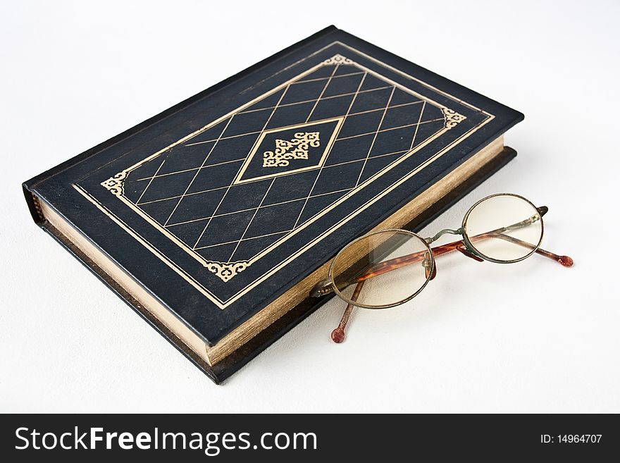 Old book with eye glass. Old book with eye glass