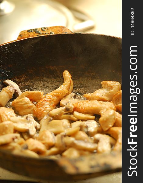 Fried mushroom on a frying-pan