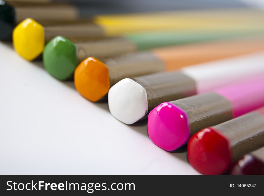 Close up of many colored pencils isolated