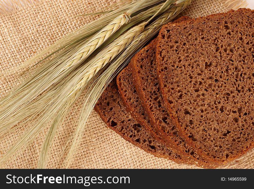 The baked bread and grain cereals close up. The baked bread and grain cereals close up