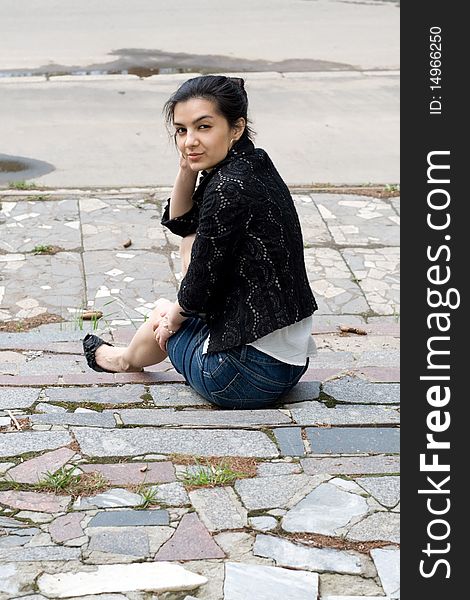 Girl sitting on stairs outdoor