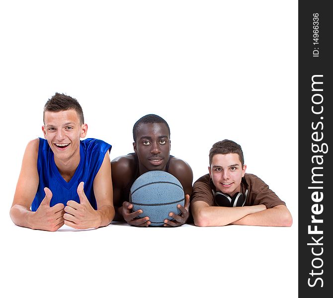 Young interracial group of happy sporty teenagers lying on the floor. Isolate over white. Young interracial group of happy sporty teenagers lying on the floor. Isolate over white.