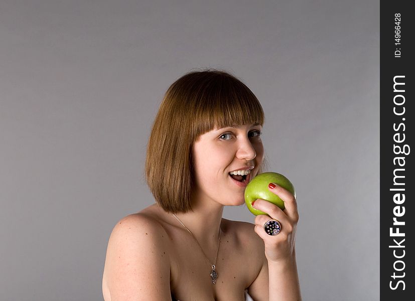 Woman with apple studio shot
