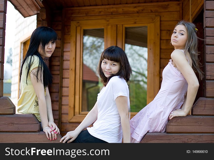 Three female friends on a veranda