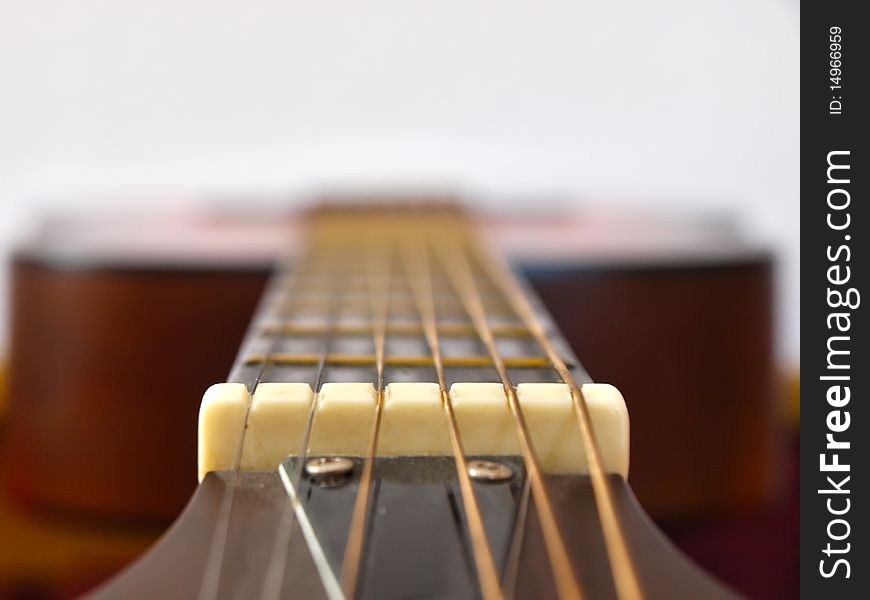 Acoustic guitar photographed from the neck. Acoustic guitar photographed from the neck