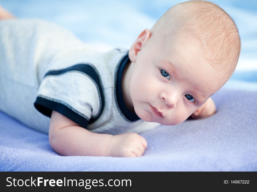 Portrait of a small cute baby boy. Portrait of a small cute baby boy.