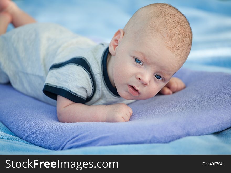 Portrait of a small cute baby boy. Portrait of a small cute baby boy.