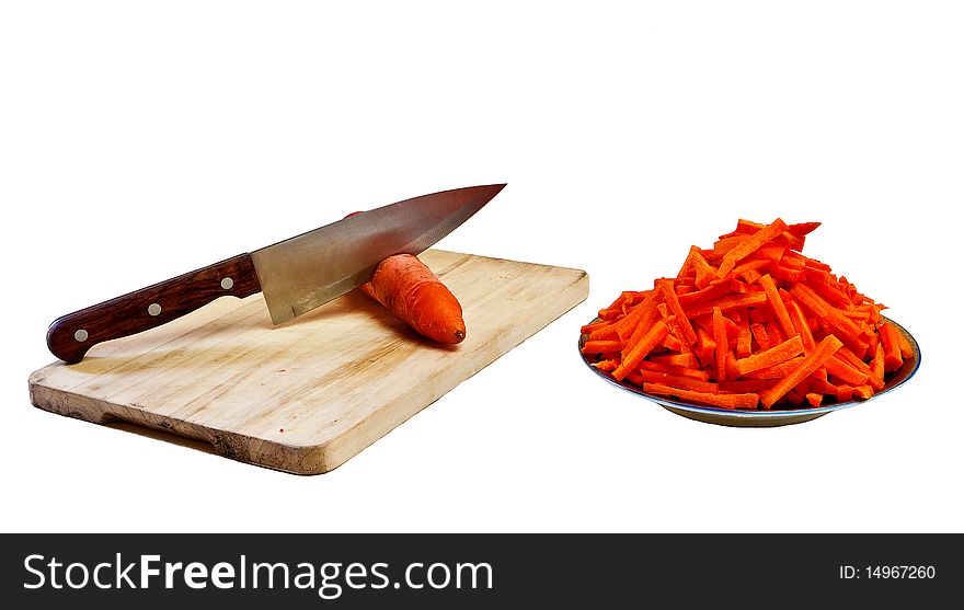 Cut red carrots, knie and chopping board on white background