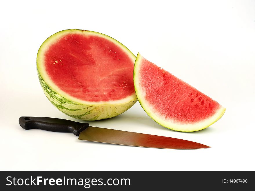 Pieces of watermelon with the knife on the white background. Pieces of watermelon with the knife on the white background