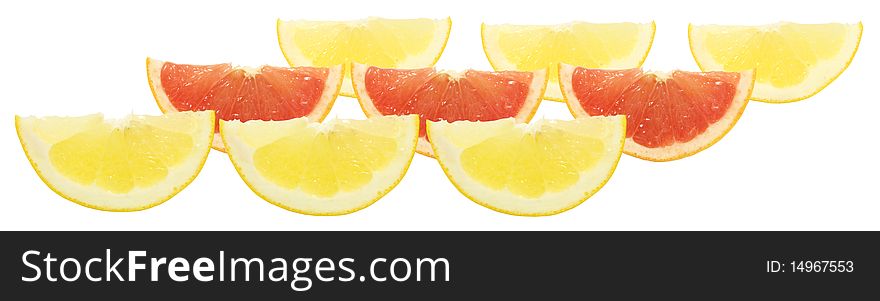 Group of yellow and red citrus slices isolated on white