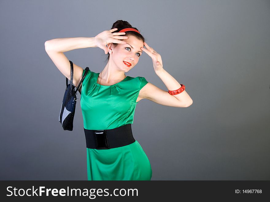 Pretty pinup girl posing in studio