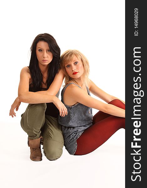 Two attractive teenage girls posing together for portraits. Two attractive teenage girls posing together for portraits