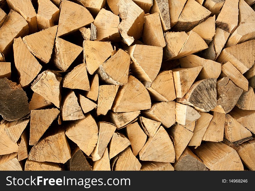 A pile of wooden logs.  Lots of texture and ring detail in the wood. A pile of wooden logs.  Lots of texture and ring detail in the wood.