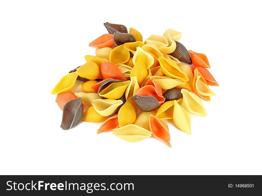 Heap of raw colored pasta shells isolated on white