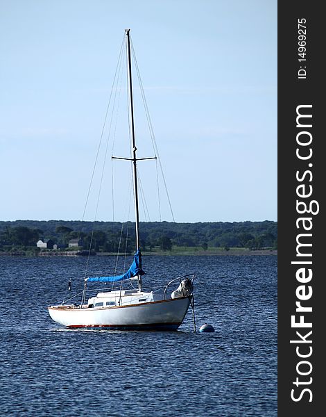 Moored white sailboat