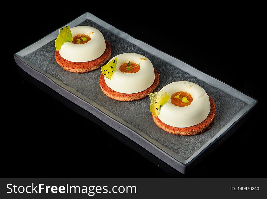 three cookies with white mousse cream and jam filling