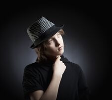 Boy With Blond Hair In Hat And Black Top Stock Image