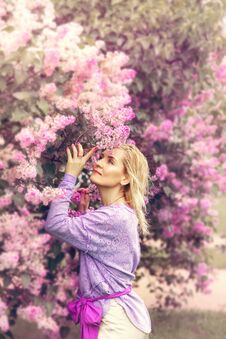 Beautiful Blond Woman In  Blooming Garden Royalty Free Stock Photography