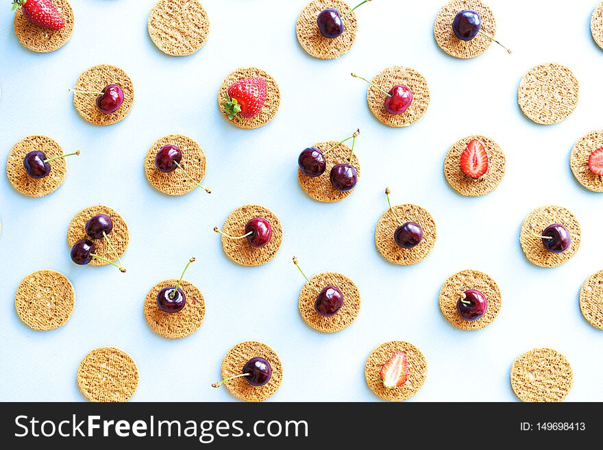 Seamless pattern of cookies and berries