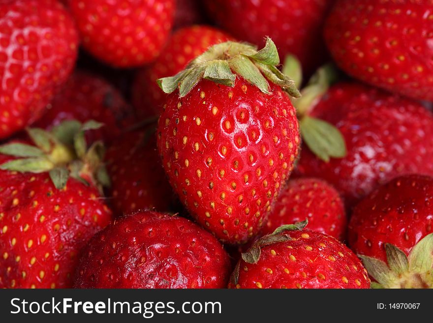 Close-up view of fresh strawberry. Selective focus on central berry