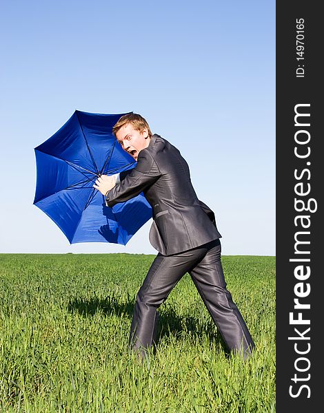 Business protection conception businessman with umbrella. Business protection conception businessman with umbrella