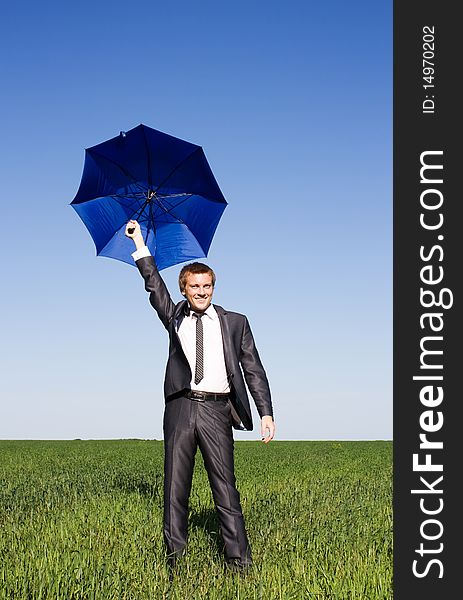 Conceptual photo of businessman flying on umbrella