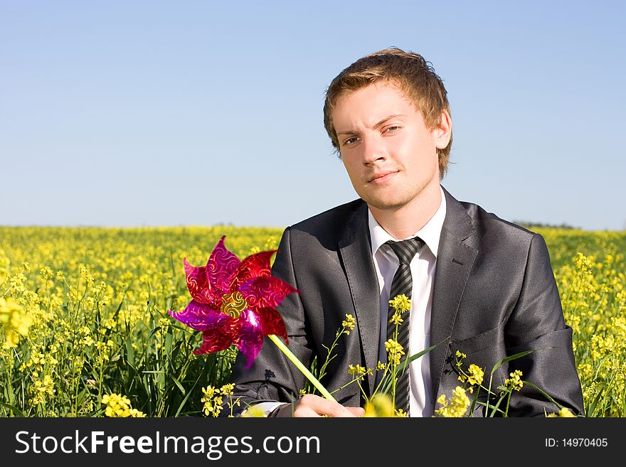 Businessman Is Resting In A Field