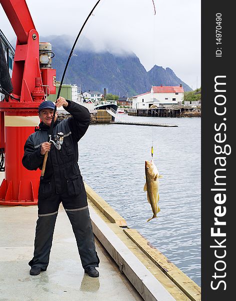 Fisherman on the pier on Lofoten island