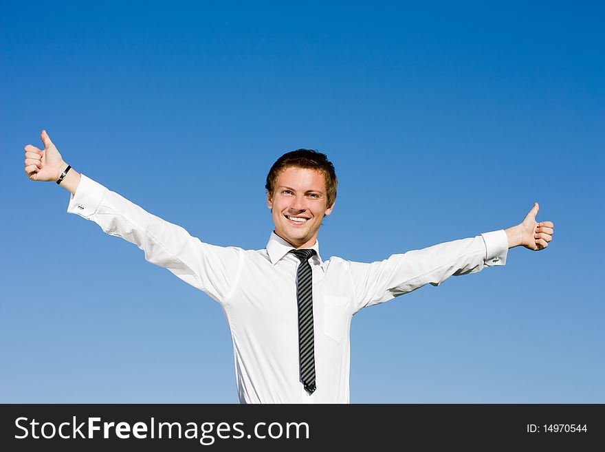 Portrait Of Happy Businessman Lifting Up Hands