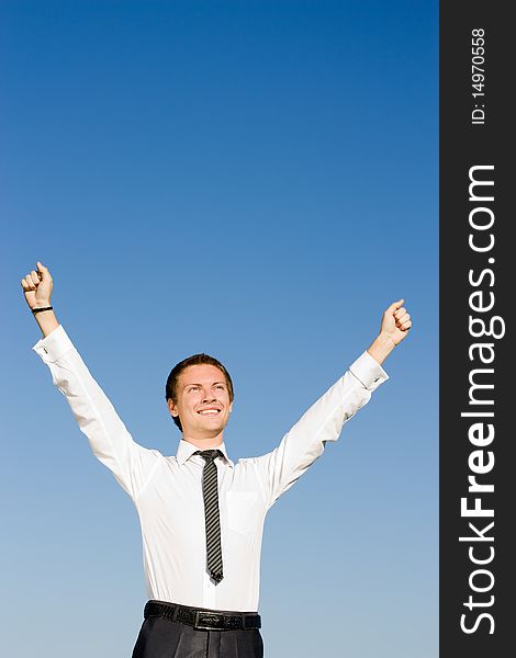Businessman in a white shirt with his hands up. Businessman in a white shirt with his hands up