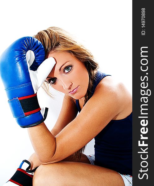 Girl with a tired face with boxing gloves. Girl with a tired face with boxing gloves