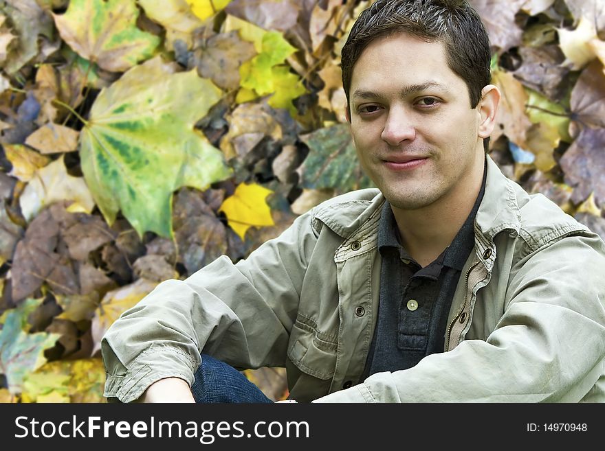 Guy against a fall Season Foliage Background. Guy against a fall Season Foliage Background.