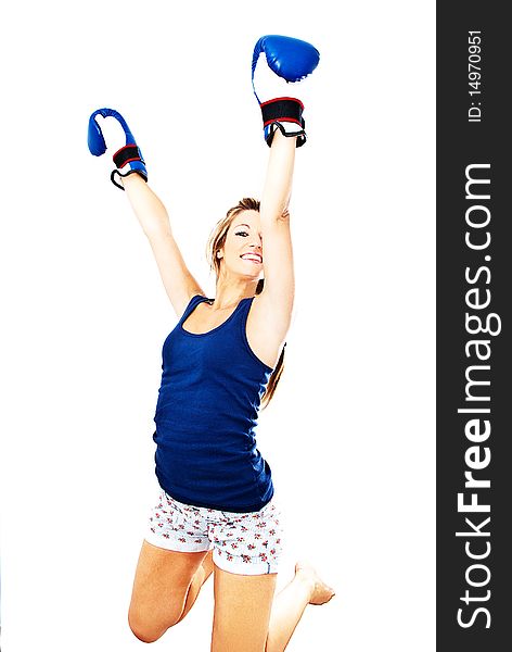 Girl jumping for joy with boxing gloves. Girl jumping for joy with boxing gloves