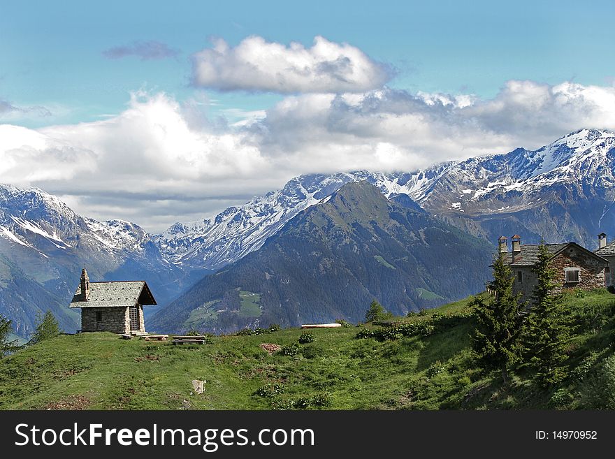 Church and farm in the alps