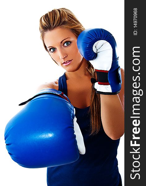 Blonde girl giving a blow in boxing. Blonde girl giving a blow in boxing