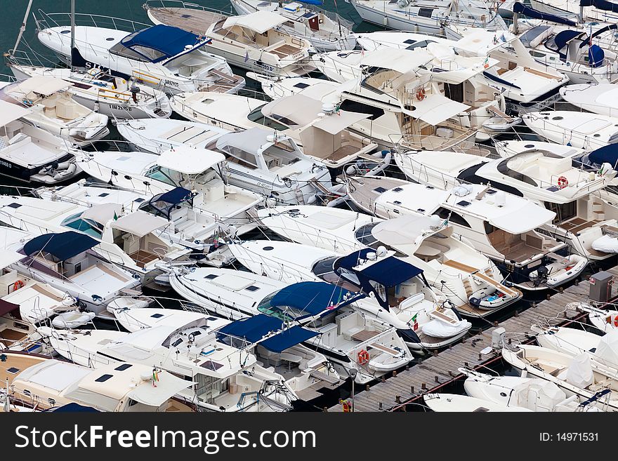 Large parking boats at sea in a small seaside town